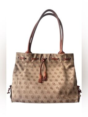 Dooney & Bourke monogram canvas and leather drawstring tote bag.